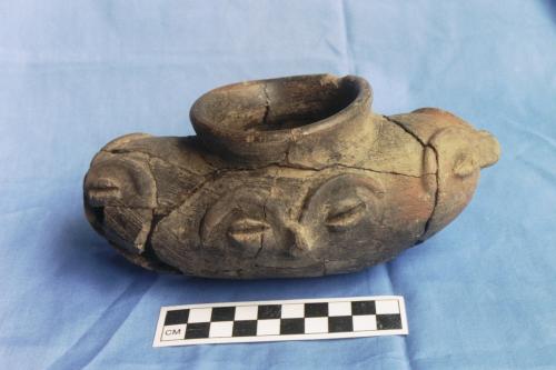 Vessel with zoomorphic faces